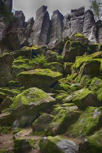 Low angle view of rock formation against sky