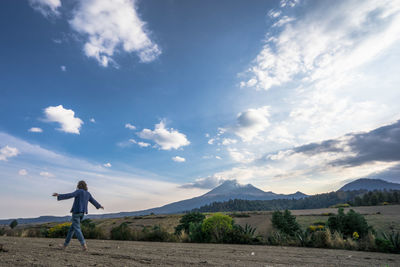 Rear view of man standing on landscape