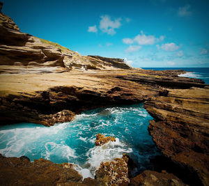 Scenic view of sea against cloudy sky