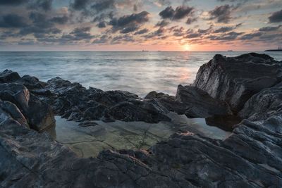 Scenic view of sea at sunset