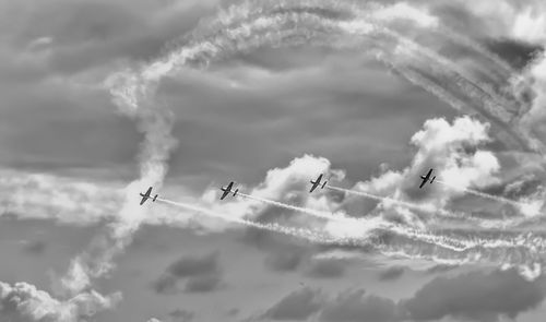 Low angle view of airshow in sky