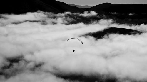 View of person paragliding against sky