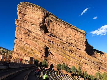 People at red rocks amphitheatre against sky