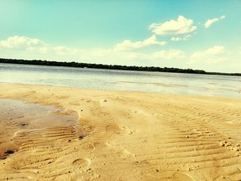 Scenic view of beach against sky