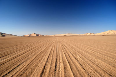 Scenic view of desert against clear sky