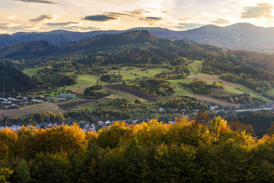 Scenic view of landscape and mountains against sky