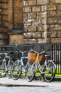 Bicycles parked against wall