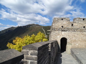 View of old ruin building against cloudy sky