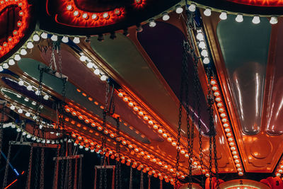 Low angle view of illuminated ferris wheel at night