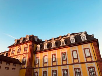 Low angle view of building against blue sky