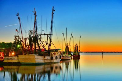 Scenic view of lake at sunset