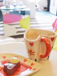 Close-up of coffee cup on table