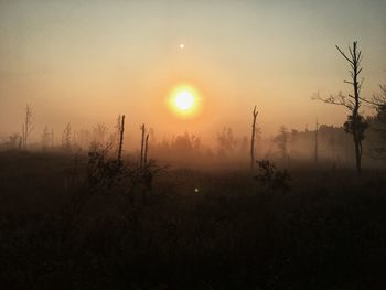 Scenic view of landscape against sky during sunset