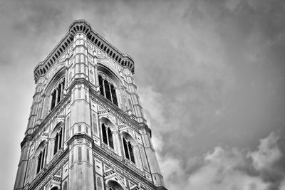 Low angle view of bell tower against sky