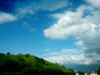 Scenic view of landscape against cloudy sky