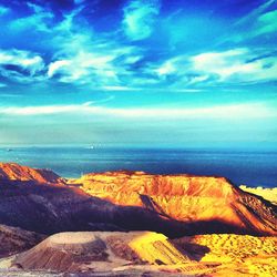 Scenic view of sea against cloudy sky