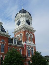 Low angle view of bell tower against sky