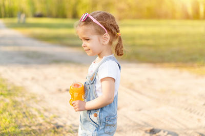 Cute girl standing in park