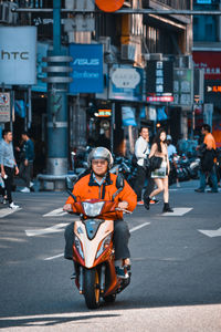 People on road in city