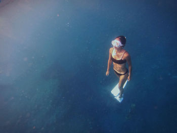 Woman swimming in sea