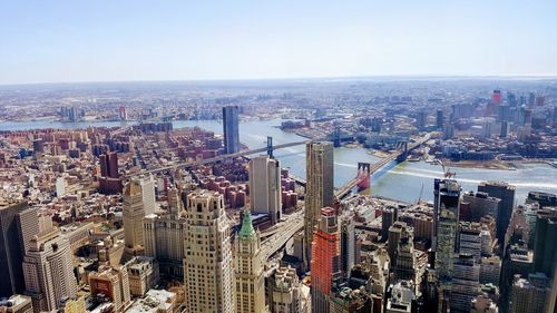 High angle view of modern buildings in city against sky