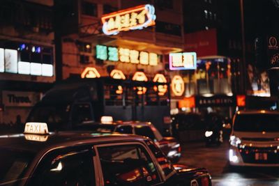 Cars on street in city at night