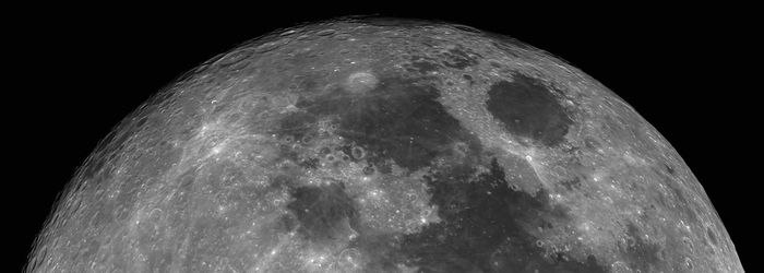 Low angle view of moon against black background