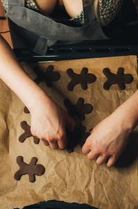 Low section of woman playing jigsaw puzzle
