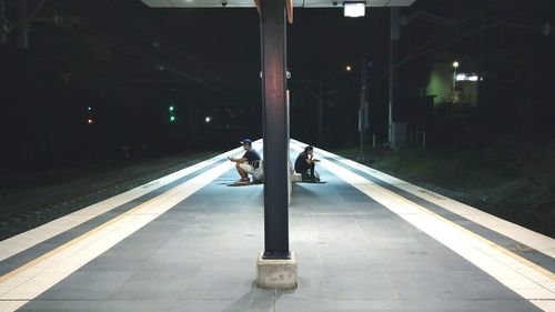 Man standing on railroad station platform