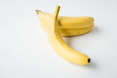 Close-up of yellow slices over white background