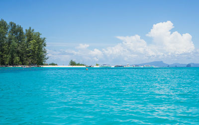 Scenic view of sea against blue sky