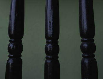 Close-up of metal railing on table