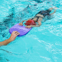 High angle view of person swimming in pool