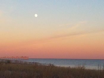 Scenic view of sea against clear sky during sunset