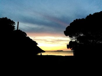 Scenic view of silhouette trees against sky during sunset