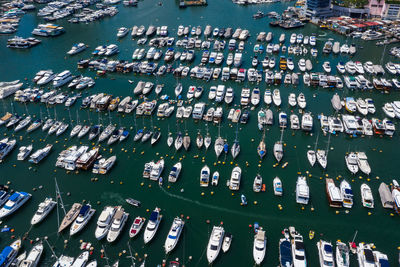 High angle view of sailboats moored at harbor