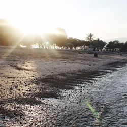 Scenic view of beach at sunset