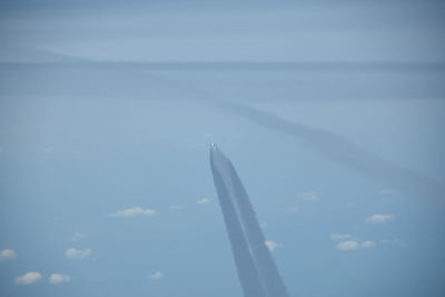 Airplane wing against sky