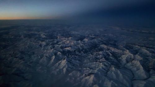 Aerial view of landscape against sky during winter