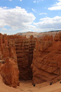 Scenic view of cliff against sky