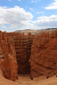 Scenic view of cliff against sky