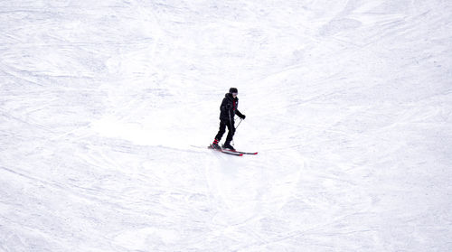 High angle view of woman on snowy field