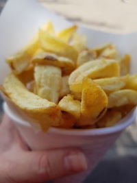 Close-up of hand holding bowl