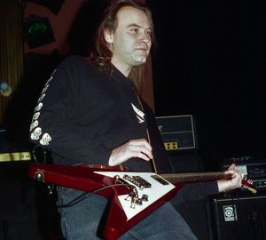 Man playing guitar at music concert