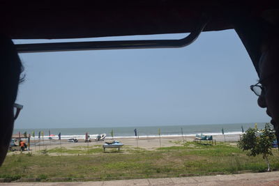 Scenic view of beach against clear sky