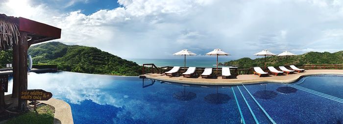 Panoramic view of swimming pool against sky
