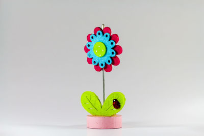 Close-up of multi colored candies against white background