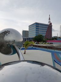 Buildings in city against sky