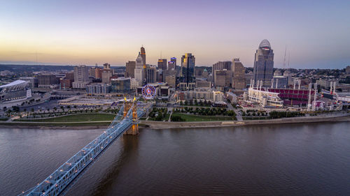 Modern buildings in city at sunset