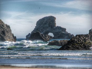 Waves splashing on rocks at beach